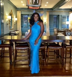 wearing a fance blue dress Dr Olatomide (Tomi) Famalusi | Élevé Plastic Surgery Plastic Surgery Atlanta